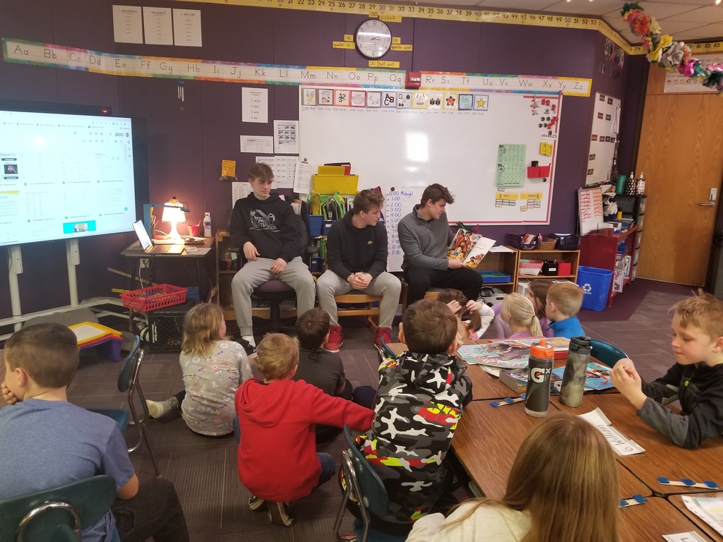 Varsity players reading to students