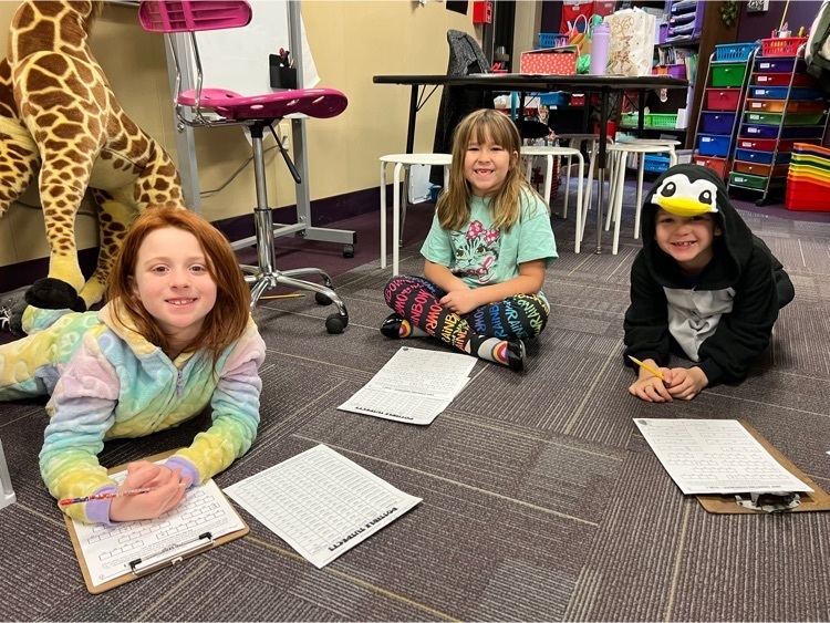 Second grade students working on a math mystery. 